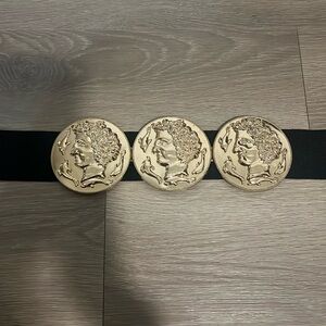 Gold medallion belt with elastic band and button closure. Fits M-L